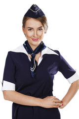 Beautiful smiling stewardess isolated on a white background