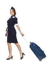 Beautiful stewardess holding suitcase isolated on white backgrou