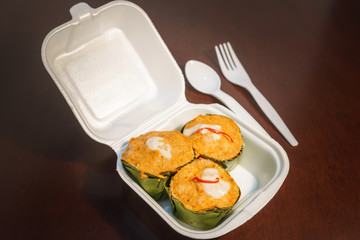 Thai steamed Fish curry in plastic foam box