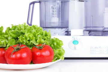 Tomatoes with green salad and kitchen processor