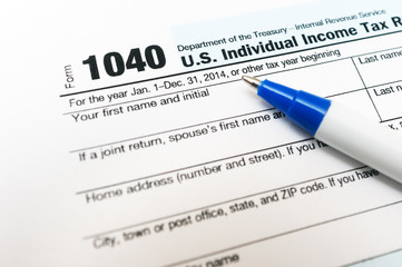 Fototapeta premium US Individual Tax Return Form 1040 close up and pen