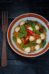 Instant noodle fried with spicy sauce and fish ball