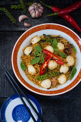 Instant noodle fried with spicy sauce and fish ball