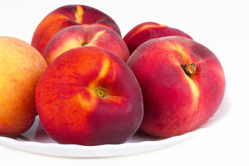 Peaches on white plate