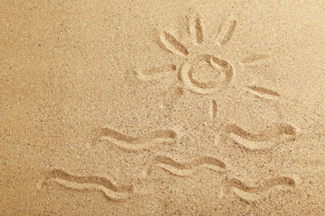 Fototapeta na wymiar Drawing sun on beach sand