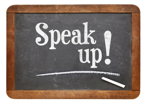 Speak up motivational phrase on blackboard