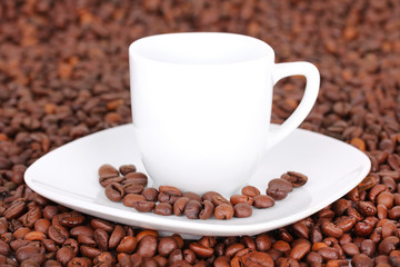 Cup in coffee beans