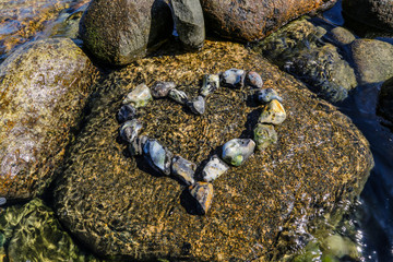 Heart of colorful stones seawater