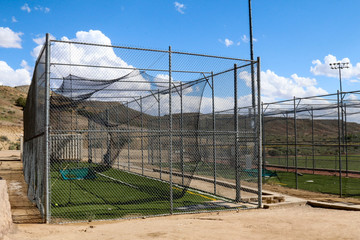 Empty batting cage outside at a softball venue in New Mexico