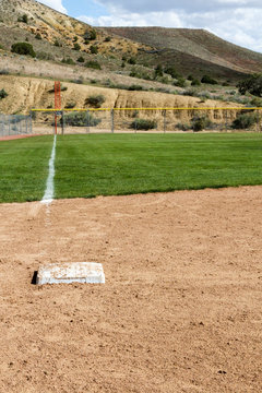 View looking down the third base line with third base at a softball diamond in New Mexico