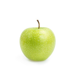 Green apple with water drops on white background.