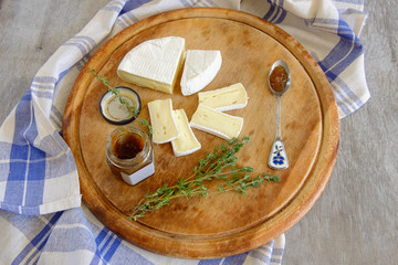 Fresh Brie cheese and a slice