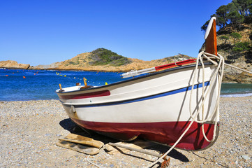 fishing boat stranded on the beach in the Costa Brava, Spain