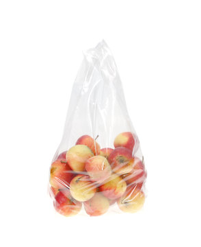 Apples in plastic bag isolated on white.