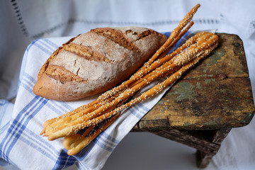 Close-up of traditional bread and Italian breadsticks.
