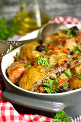 Rabbit baked with young potato in a cream.