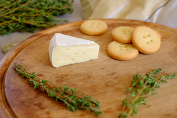 Fresh Brie cheese and a slice