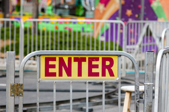 Entrance sign on the gate to a carnival ride
