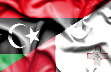 Waving flag of Malta and Libya