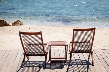Two sitting place and table in a tropical beach