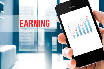 Closeup hand holding mobile phone show analyzing graph