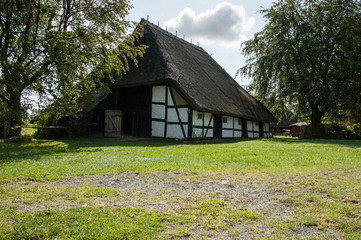 Fototapeta na wymiar old farmhouse with a thatched roof