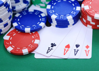 Four aces with colorful token