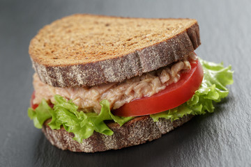 Sandwich with tuna and vegetables on rye bread