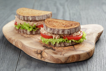 Sandwich with tuna and vegetables on rye bread