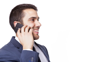 Side view of a business man talking on cell phone, isolated on w