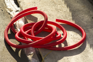 construction worker works repairing the pipes