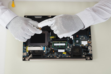 Fototapeta na wymiar Technician Repairing Laptop