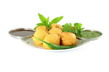 potato vada pakoda or fritter indian food snack in pure white background