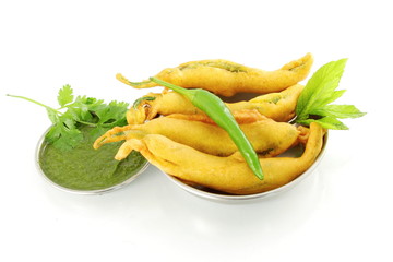 chili  pakoda or fritter indian food snack in pure white background