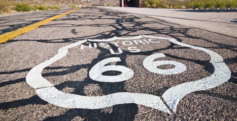 Fotobehang Route 66 pavement sign with Mojave desert  © donvictori0
