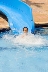 Boy play blue slider