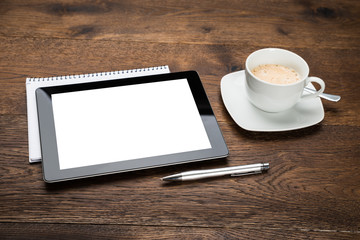 Fototapeta na wymiar Digital Tablet And Diary With Cup Of Tea