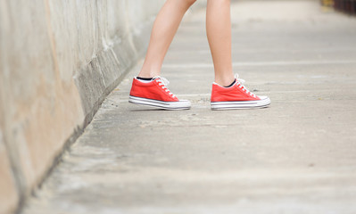 Focus on girl in red shoe