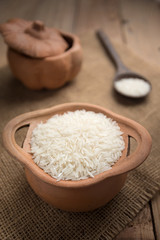Rice in earthen pot with spoon