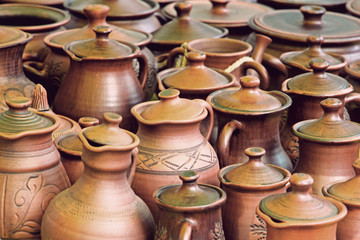 Fototapeta na wymiar Lot of ceramics pots for sale taken closeup.