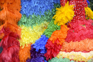 Gay pride rainbow flag dress detail close-up of colorful ruffles 