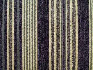 close up brown and dark purple lines striped fabric texture background, vertical striped pattern of earth tone color flannel of vintage sofa padded