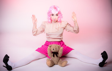 childlike woman with teddy bear toy