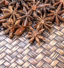 Star anise spice over wicker background