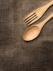 Spoon and fork on sackcloth