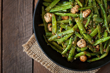 Green beans fried with chicken meatballs and garlic Asian style