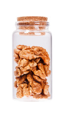 Walnut in a glass bottle with cork stopper, isolated on white.