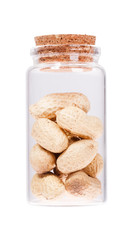 Dried peanuts in a glass bottle with cork stopper, isolated on w