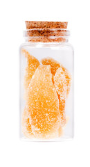 Ginger slices in a glass bottle with cork stopper, isolated on w