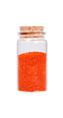 Red chili pepper in a glass bottle with cork stopper, isolated o